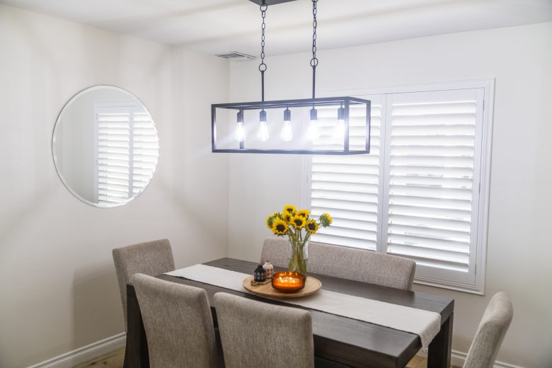 southern california home dining room with plantation style interior shutters